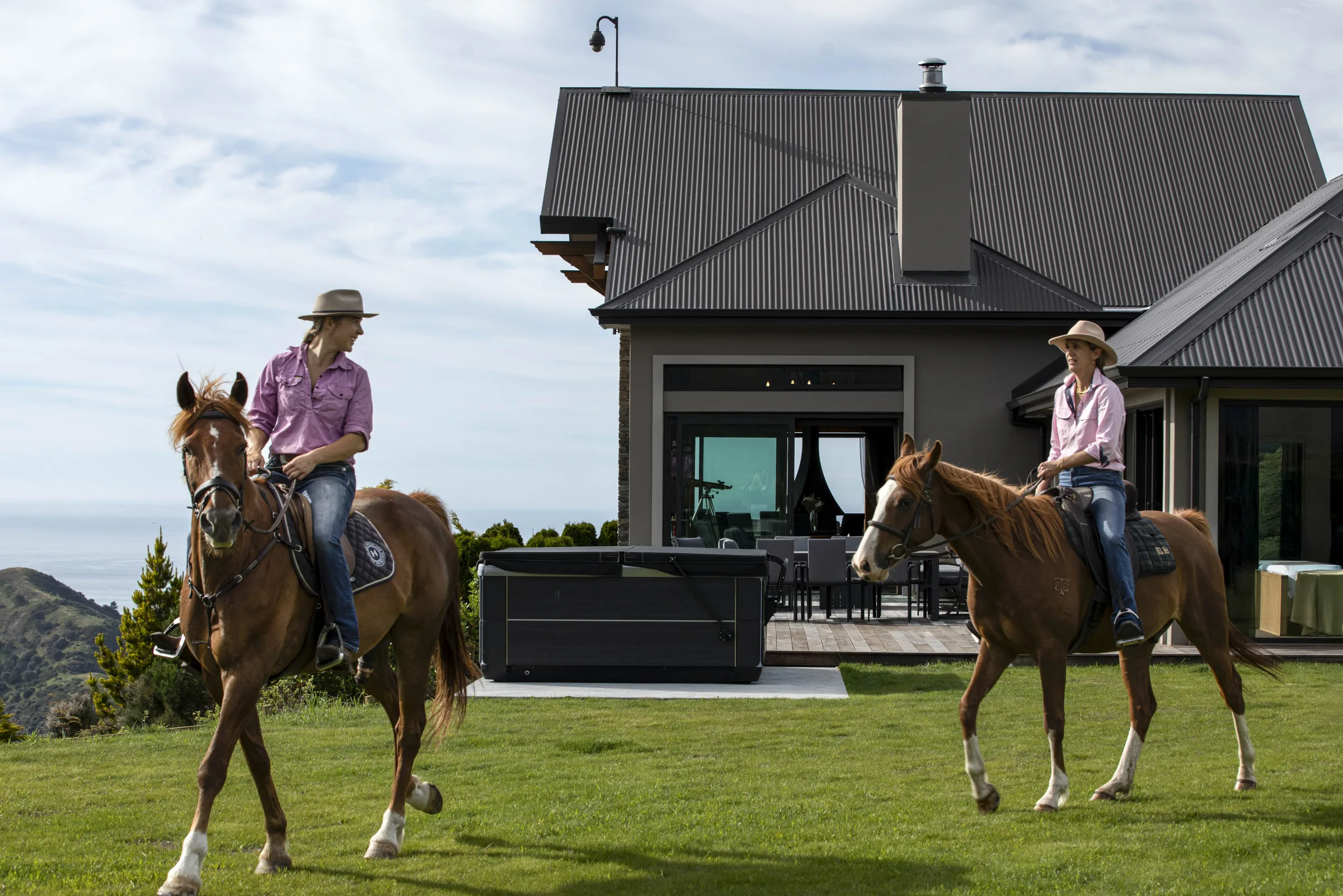 Horse riders in front of the lodge