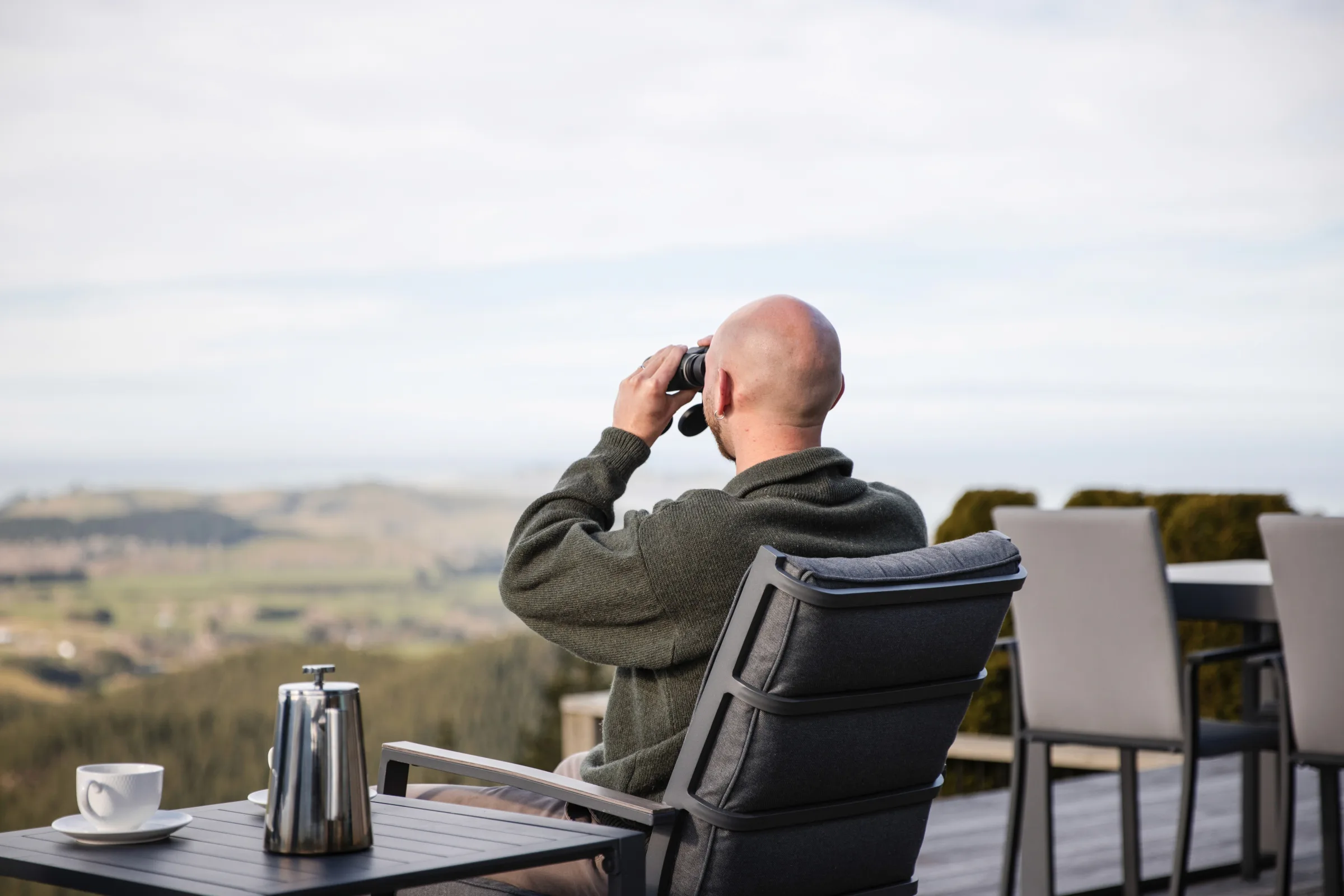 Guest taking in the view at Ata Rangi Lodge